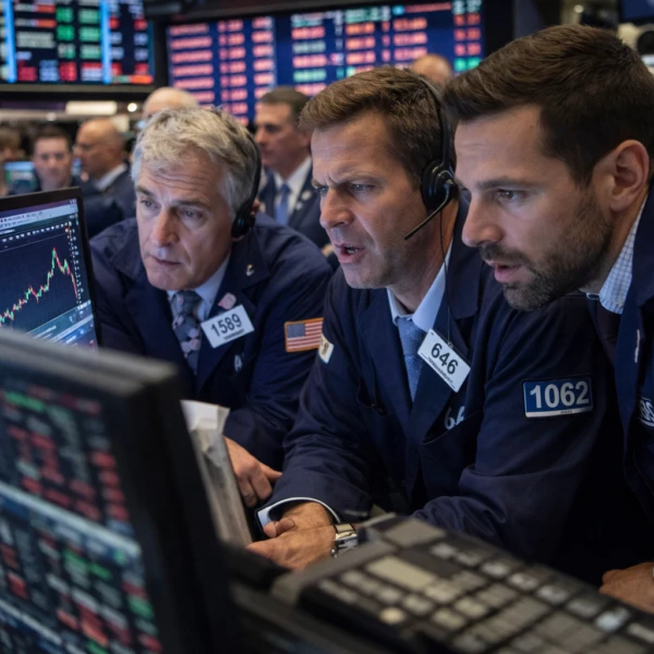 Wall Street traders looking at market data.