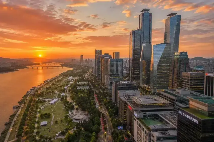 Aerial view of Seoul's Yeouido financial district skyline and Han River at sunset